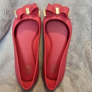 Mel Dreamed by Melissa Pink slides with gold trimmed bow